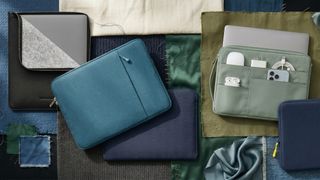 Selection of 15-inch MacBook Air M5 cases on a background of fabrics