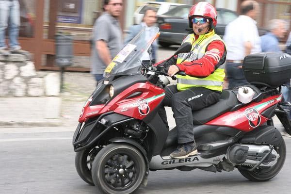 The three-wheeled scooter is a fixture of the Giro caravan this year