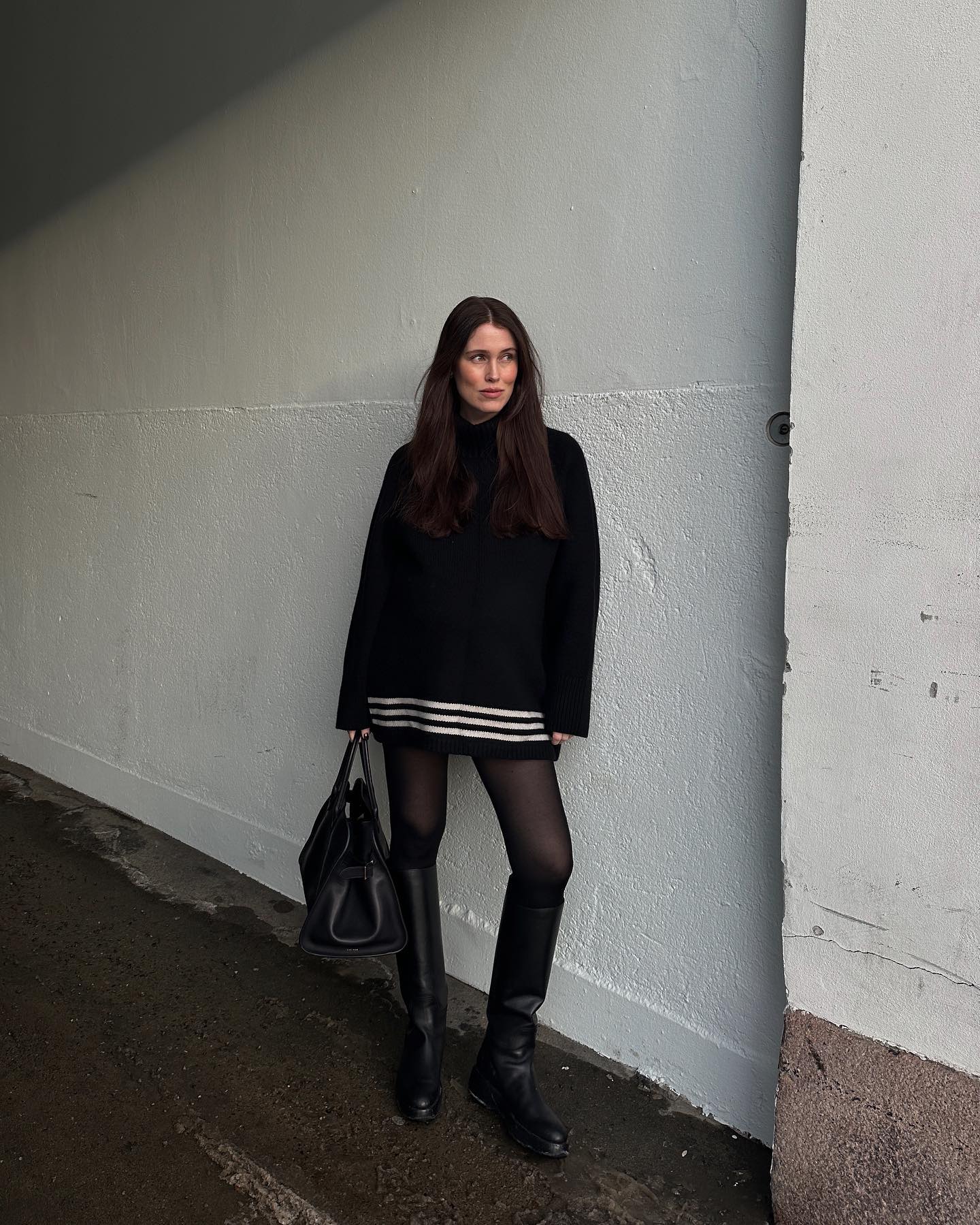 Stylish women wearing mini dresses and knee high boots