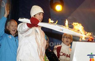 Mountain biker Tyler Allison lights the Olympic Cauldron in Whistler, British Columbia, in advance of the 2010 Winter Olympic Games.