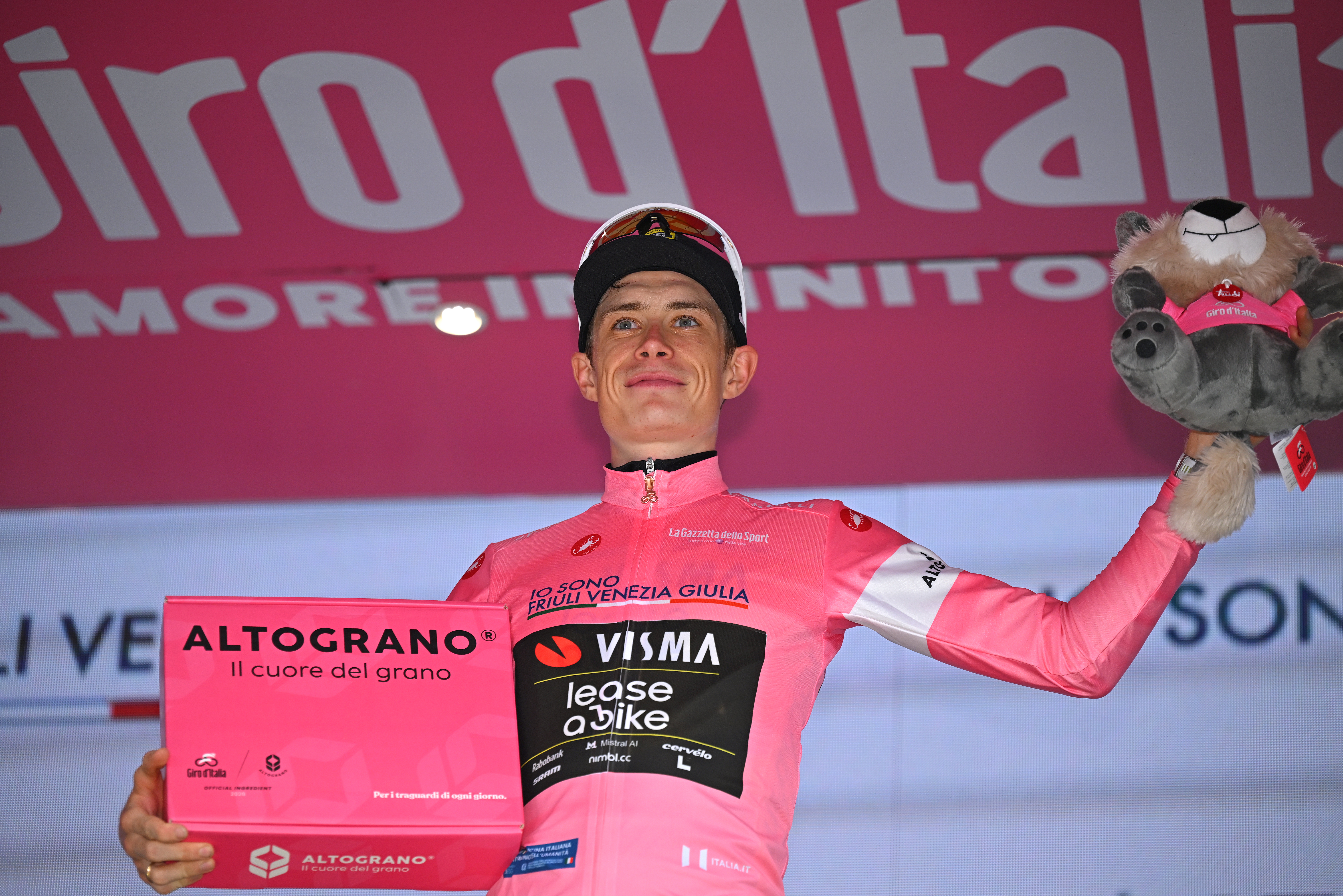 Jonas Vingegaard of Denmark and Team Visma | Lease a Bike celebrates at podium as Pink Leader Jersey winner during the 109th Giro d'Italia