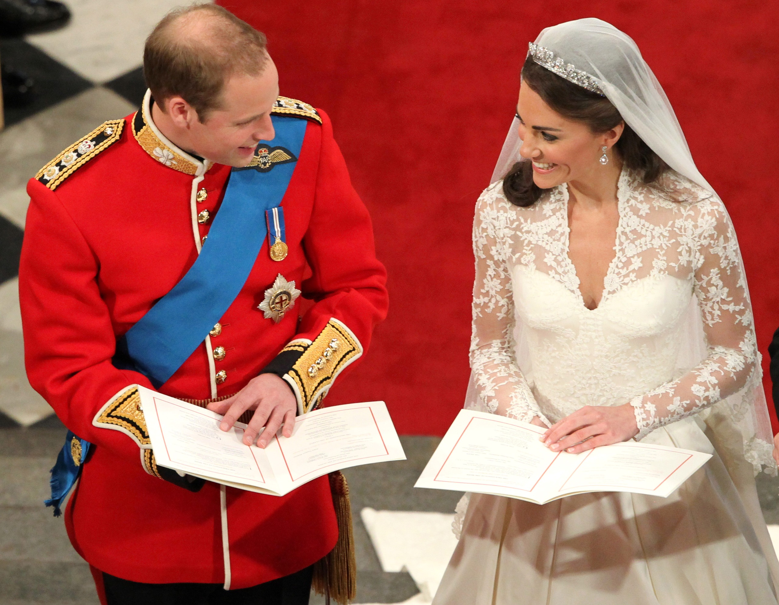 Princess Kate smiling at Prince William at the altar on their wedding day