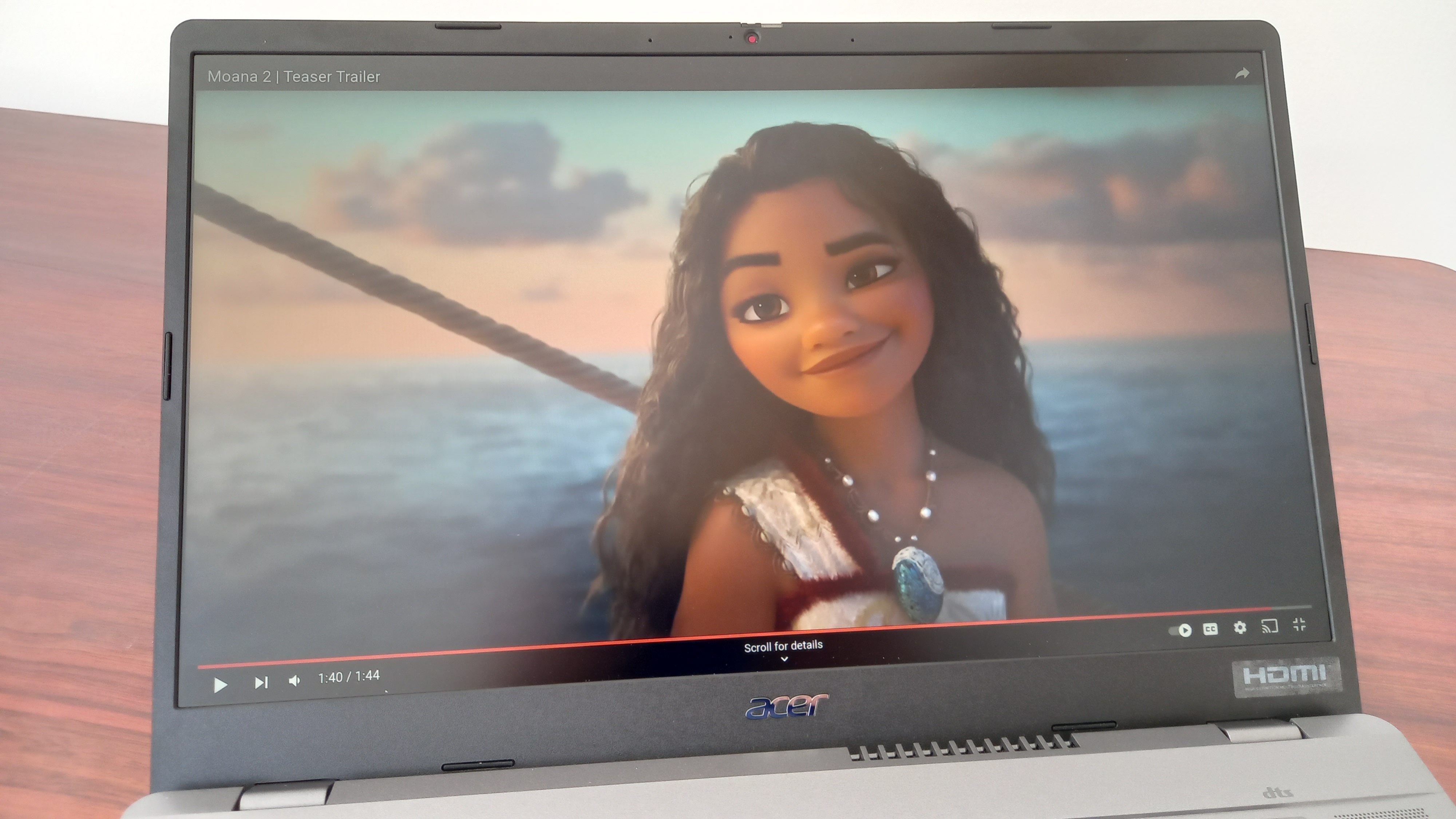 Screen of Acer Chromebook Plus 515 on desk showing the animated Disney character Moana