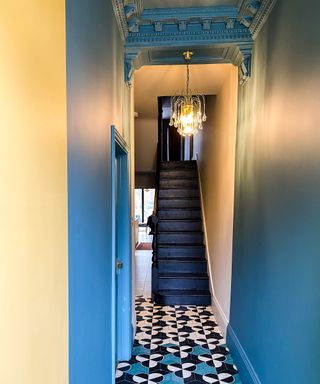 Hallway with staircase paint ideas using Myland paint colors: Sinner© No.238 (Stairs), Temple Bar© No.70 (Walls) and Burlington Arcade© No.216 (Foreground Walls)