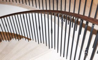 staircase with wooden side holder