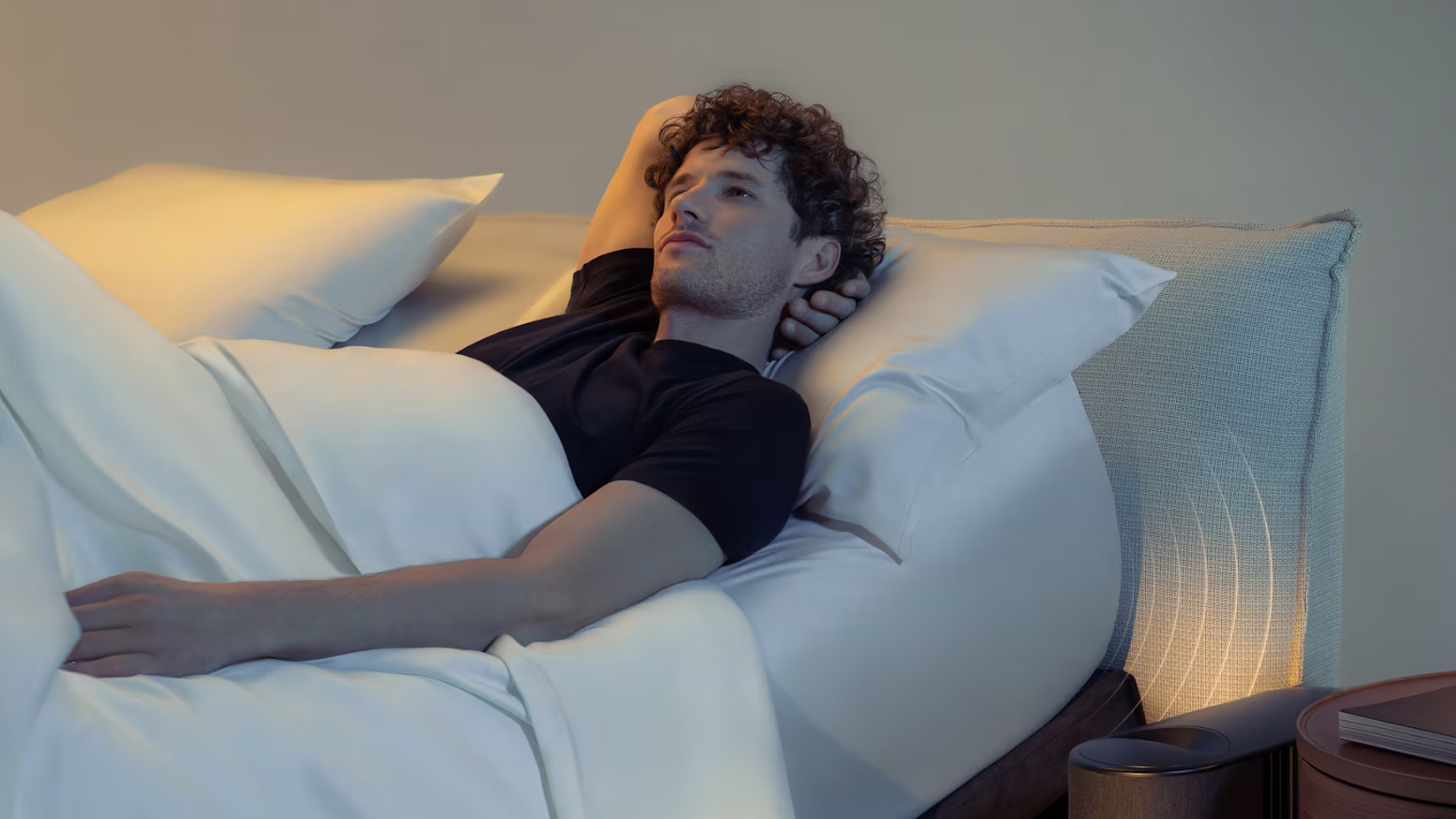 A man lying on an Eight Pod mattress