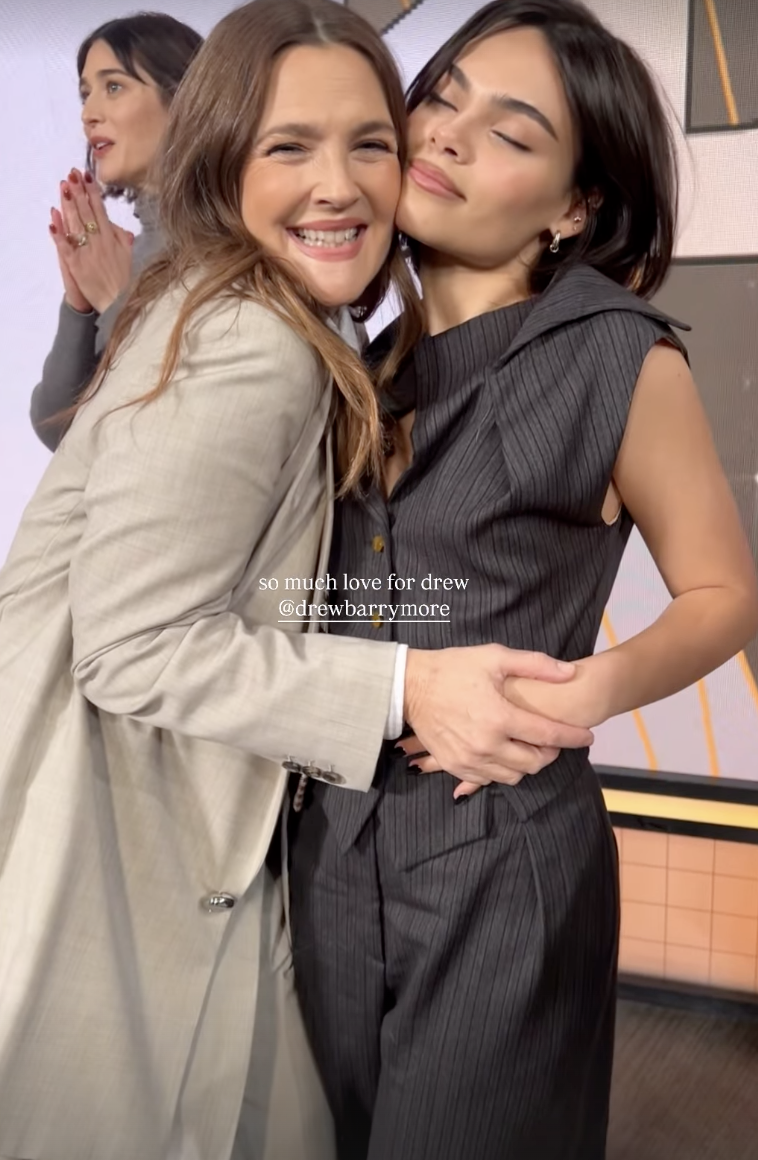 Ariana Greenblatt wore a pinstripe pant set under her Penny Lane coat