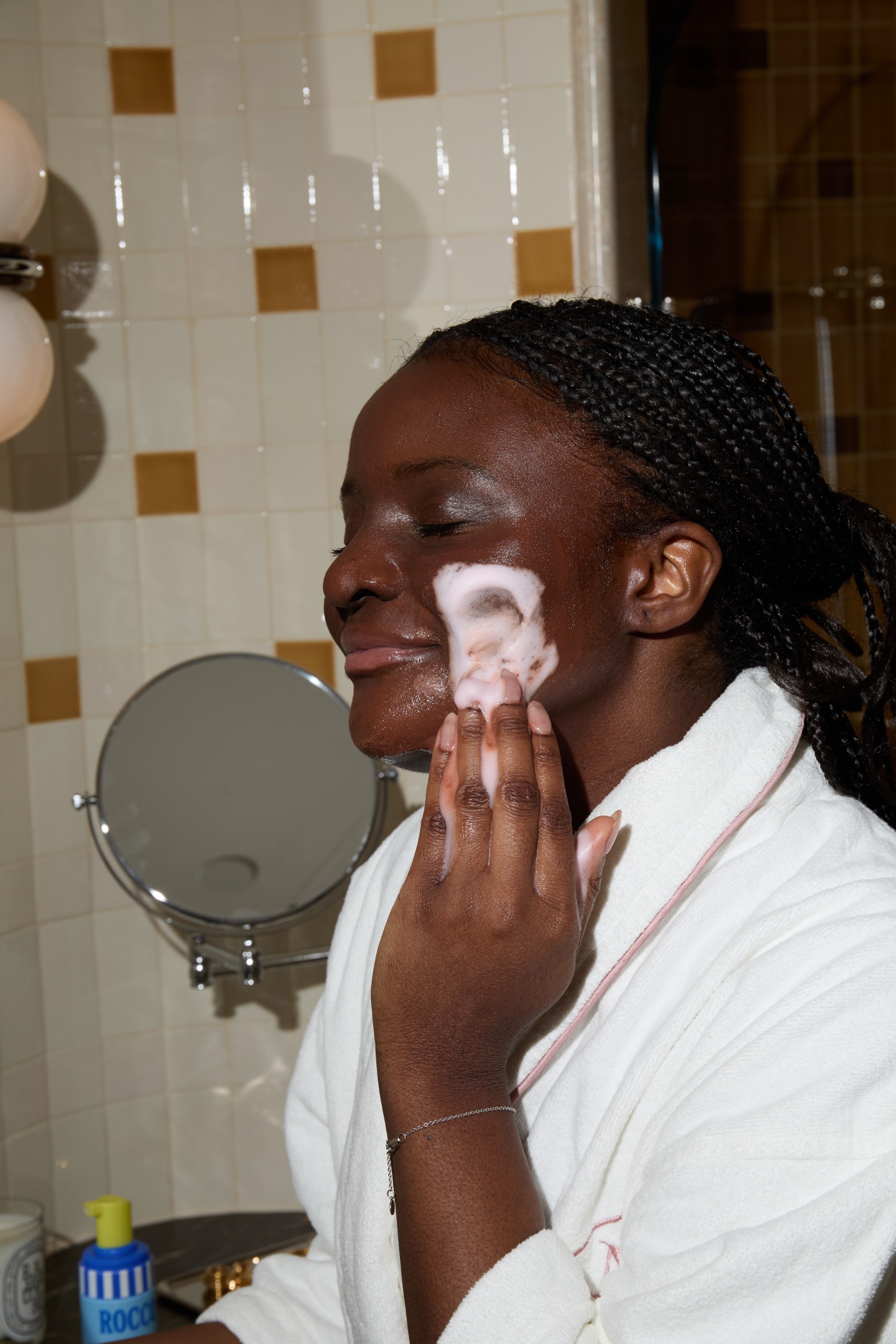Brittant Davy applying the Rocco cleanser to her skin