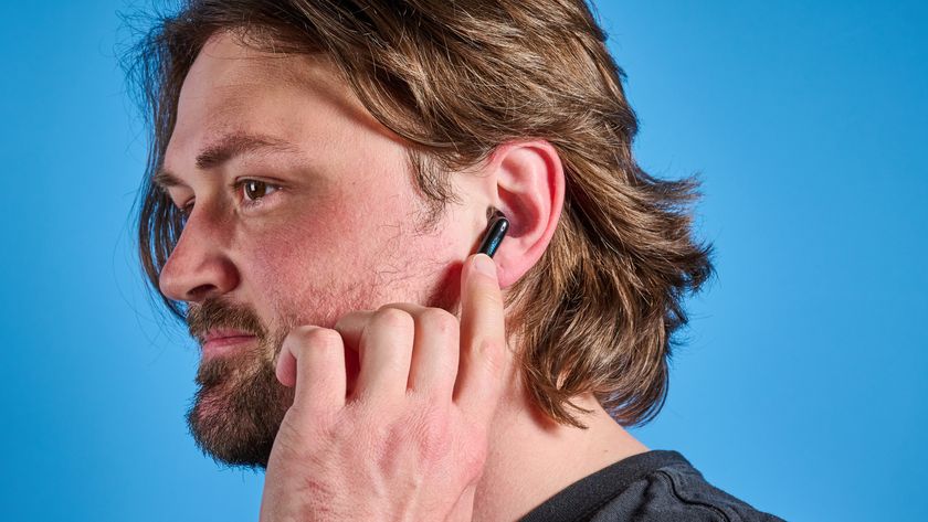 the h2o audio ript-lite earbuds in black and blue, photographed against a blue background, for both working out and everyday use