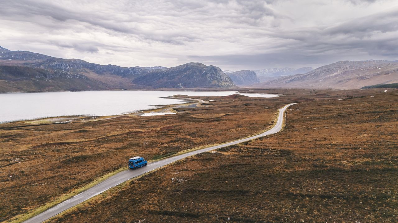 A solitary caravan is stopped next to Loch Eriboll on the North Coast 500