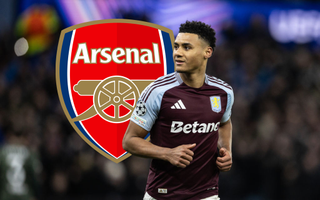 Aston Villa striker Ollie Watkins in the Champions League with the Arsenal crest and club badge behind him