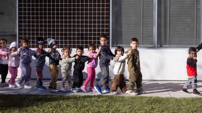 Head Start students walk to a classroom at an elementary school in Los Angeles.