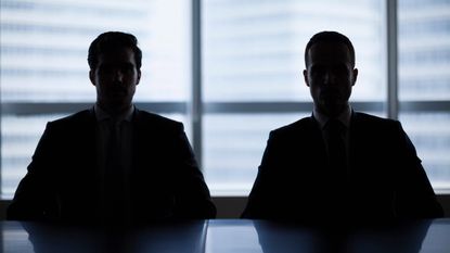 Silhouette pair of businessmen in meeting room