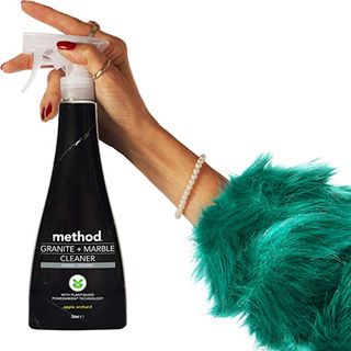 Woman holding Method Granite and Marble Cleaning Spray
