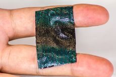The flexible sensor covers two fingers of a person's hand.