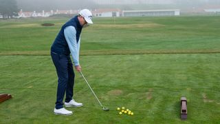 Man about to hit ball on driving range