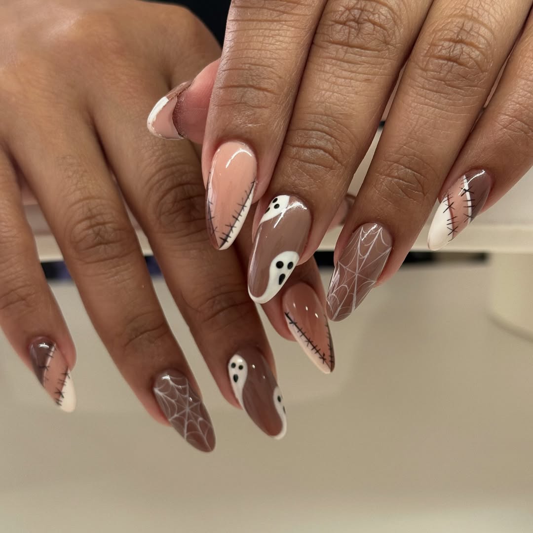 brown and white halloween manicure with ghost designs