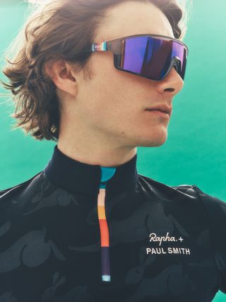 Man in Paul Smith Rapha cycling sunglasses and jersey