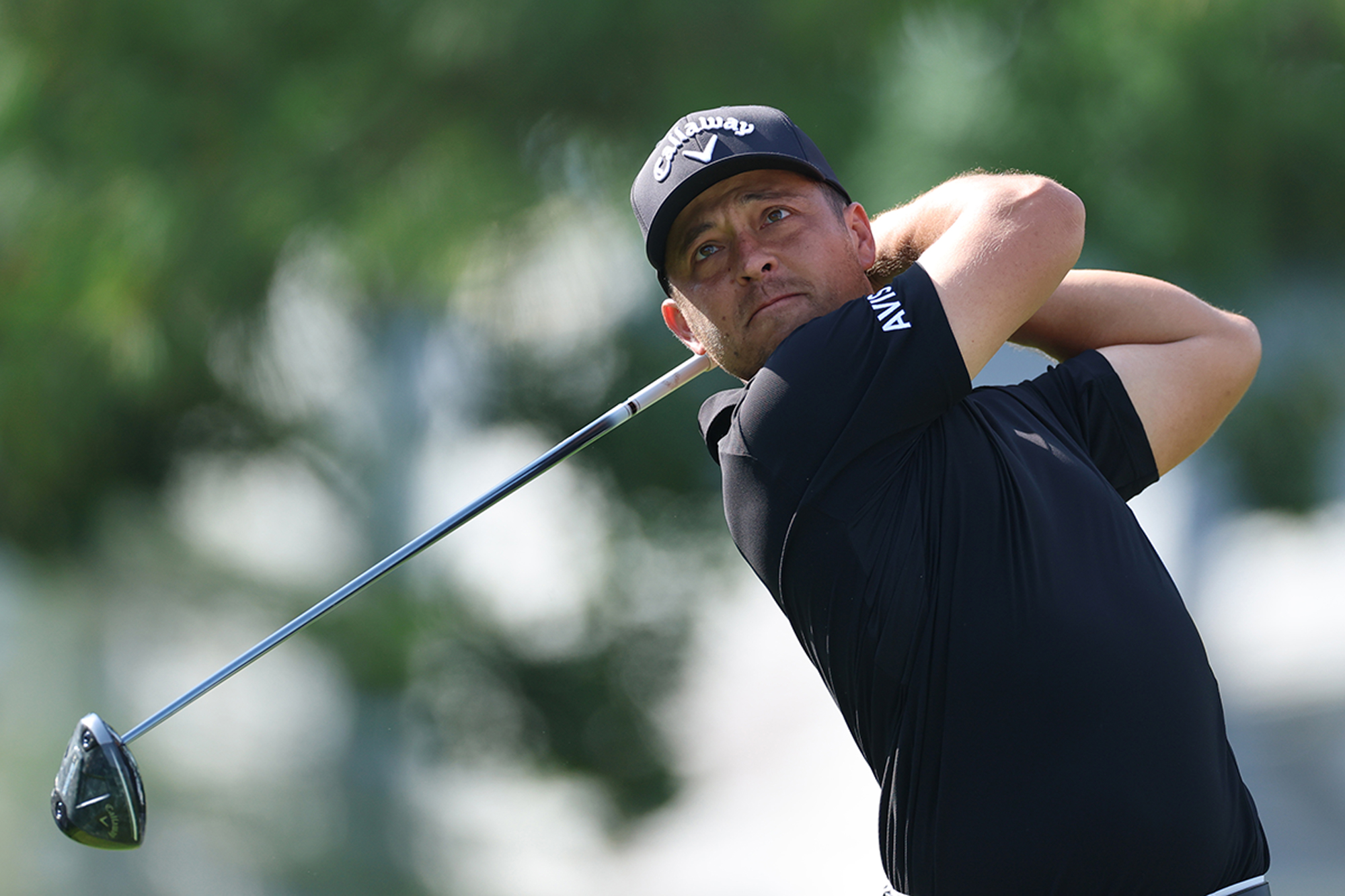 Xander Schauffele in the finish position watching his golf ball after hitting a tee shot with driver at the PGA Championship at Quail Hollow