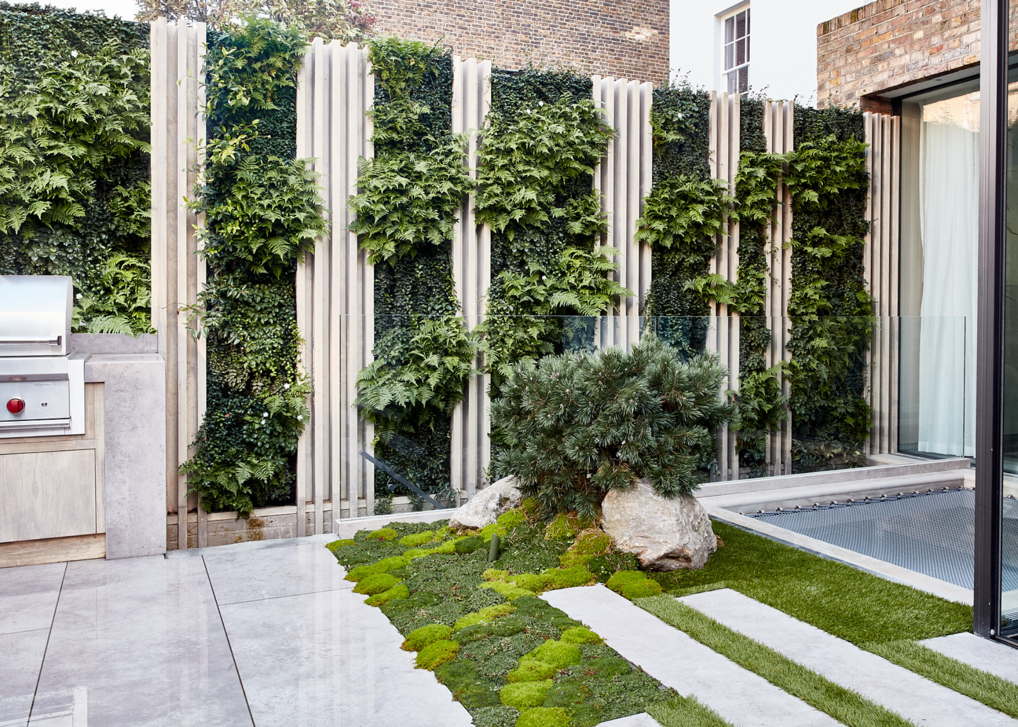 vertical garden slats on a patio in an urban courtyard