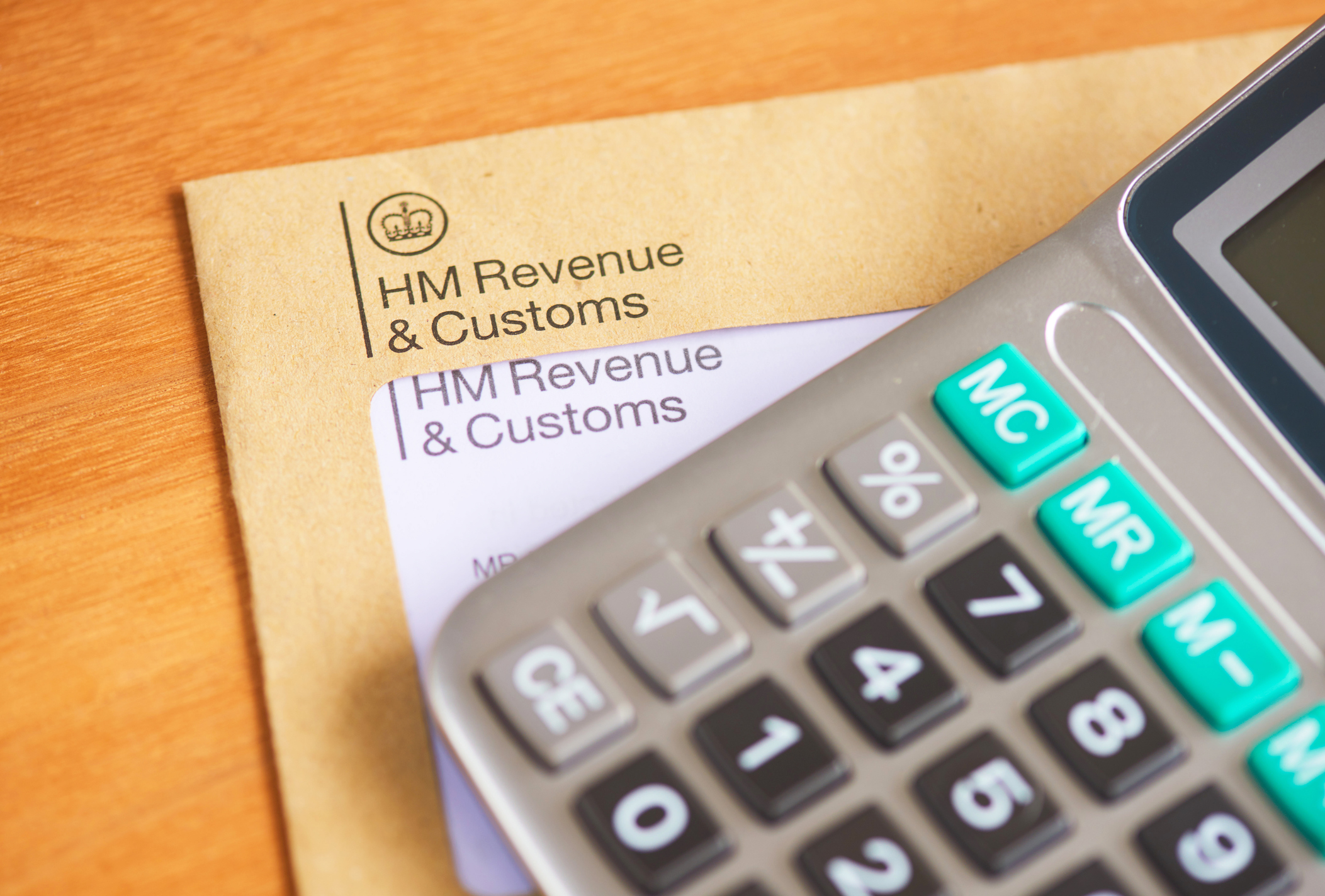 Calculator on top of an envelope from HMRC