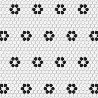 A square of white tiles with black tiles in hexagonal patterns