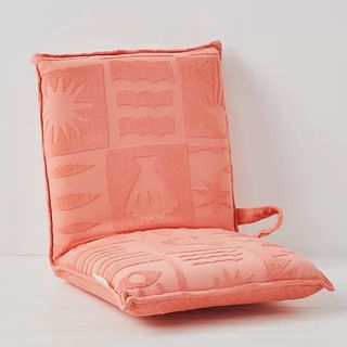 Coral chair cushion on white background