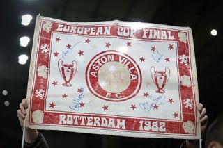 A fan of Aston Villa holds up a European Cup Final Rotterdam 1982 banner during the UEFA Europa Conference League 2023/24 round of 16 second leg match between Aston Villa and AFC Ajax at Villa Park on March 14, 2024 in Birmingham, England.