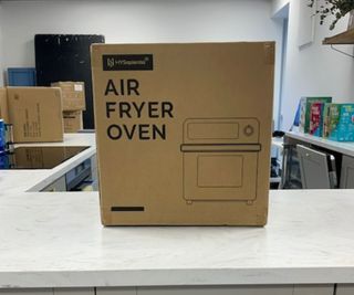 HYSapientia 15L Air Fryer in a box on a kitchen counter.
