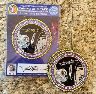 Examples of the John Herrington "Signature Edition" gold and silver patches, as well as their signed display cards.
