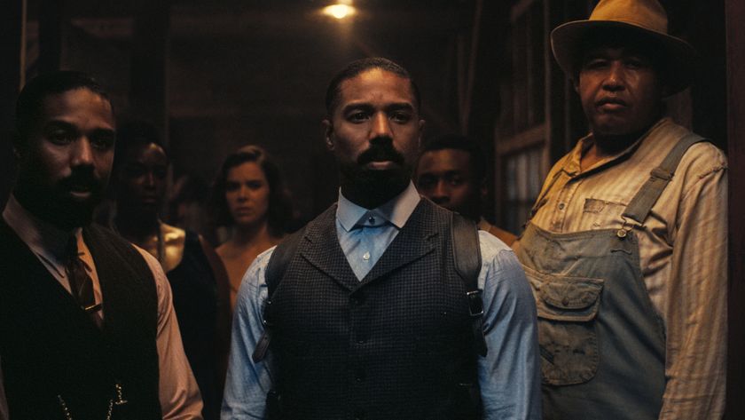 Twin Michael B Jordans stand guard at the door with Omar Benson Miller in Sinners.