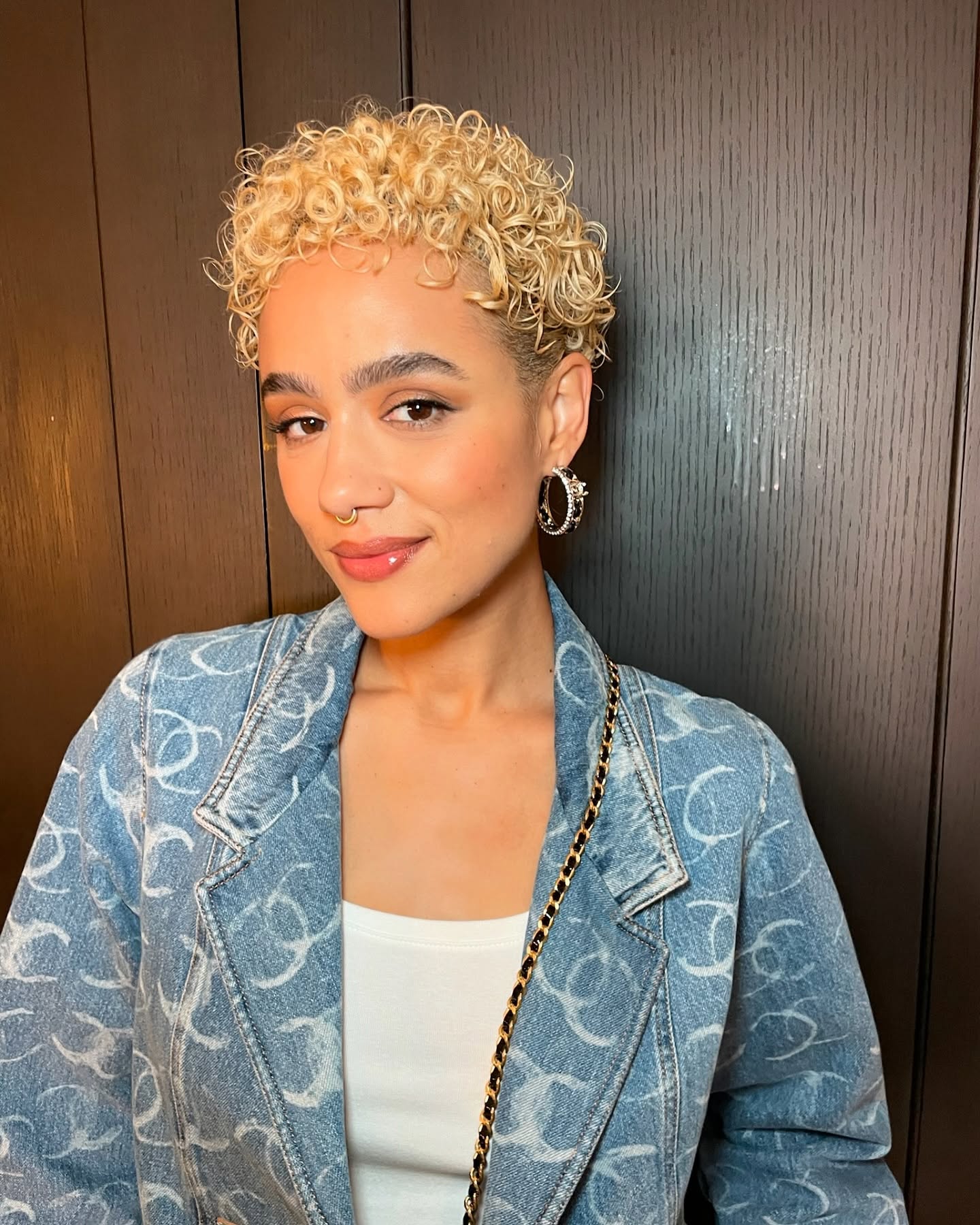Nathalie Emmanuel with curly cropped blonde hair