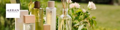 Arran logo top left with a long banner of arran scents