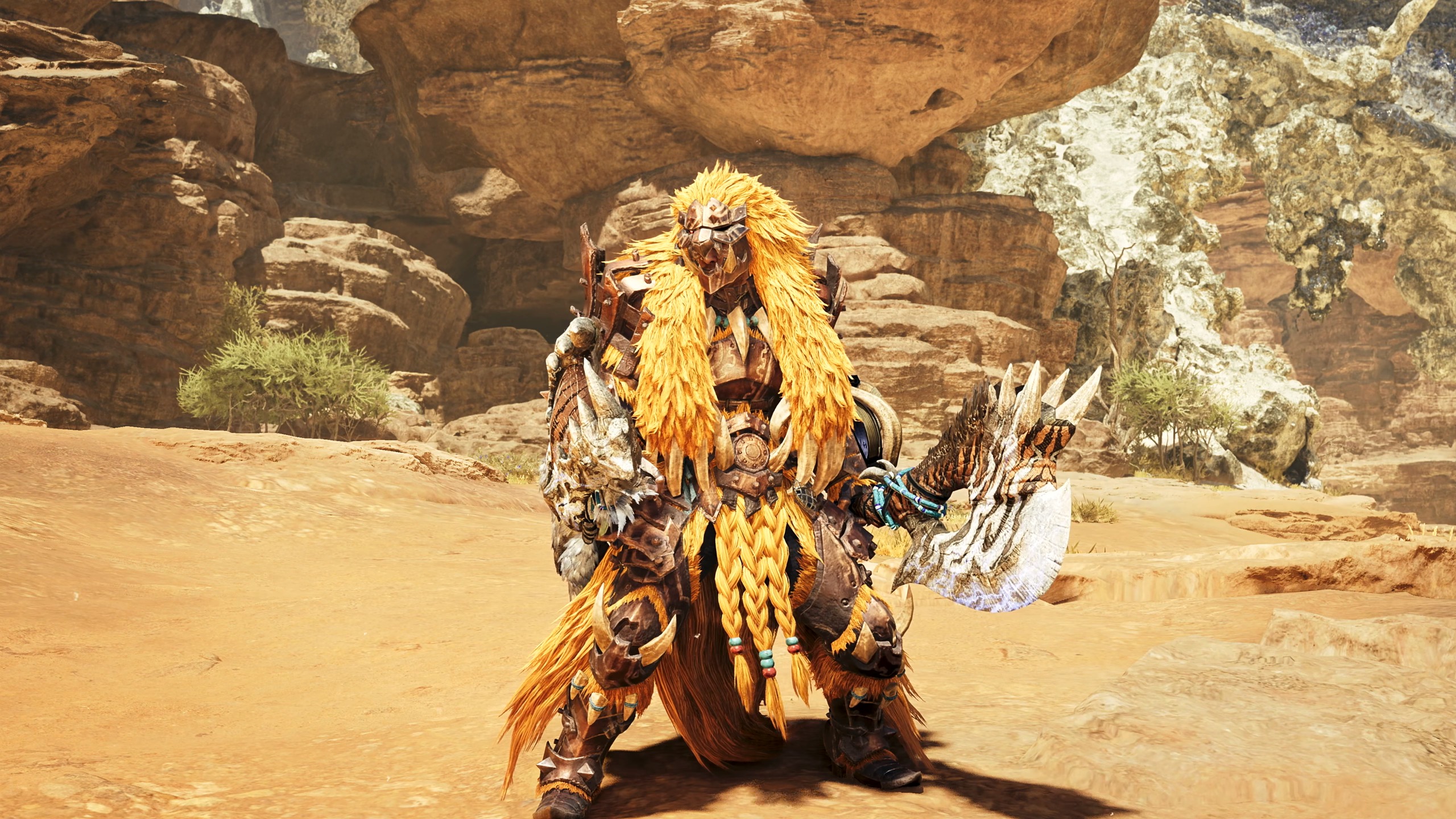 A warrior in ornate, fur-trimmed brown armor stands in a desert canyon, holding a large, jagged axe with a glowing, patterned blade in one hand.