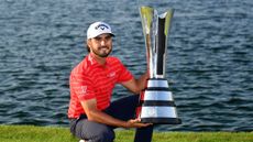 Abraham Ancer with the PIF Saudi International trophy