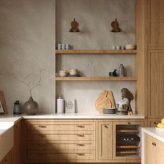 A woodern kitchen with open shelving and stone walls