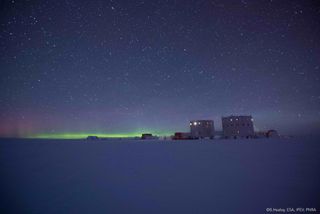 Auroras and stars over Concordia base in Antarctica.