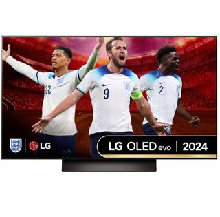 The LG OLED48C4 TV pictured against a white background. The screen shows three England footballers – Jude Bellingham, Harry Kane, and Bukayo Saka – all celebrating. They are superimposed onto a background of a stadium and wearing white England shirts with blue shoulders.