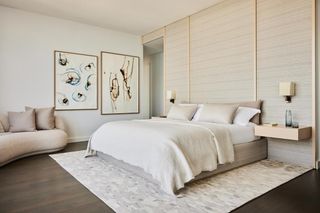 A master bedroom with low profile headboard