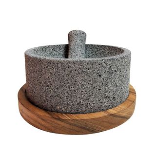 A lava stone pestle and mortar