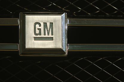 The General Motors logo appears on a car in Berlin