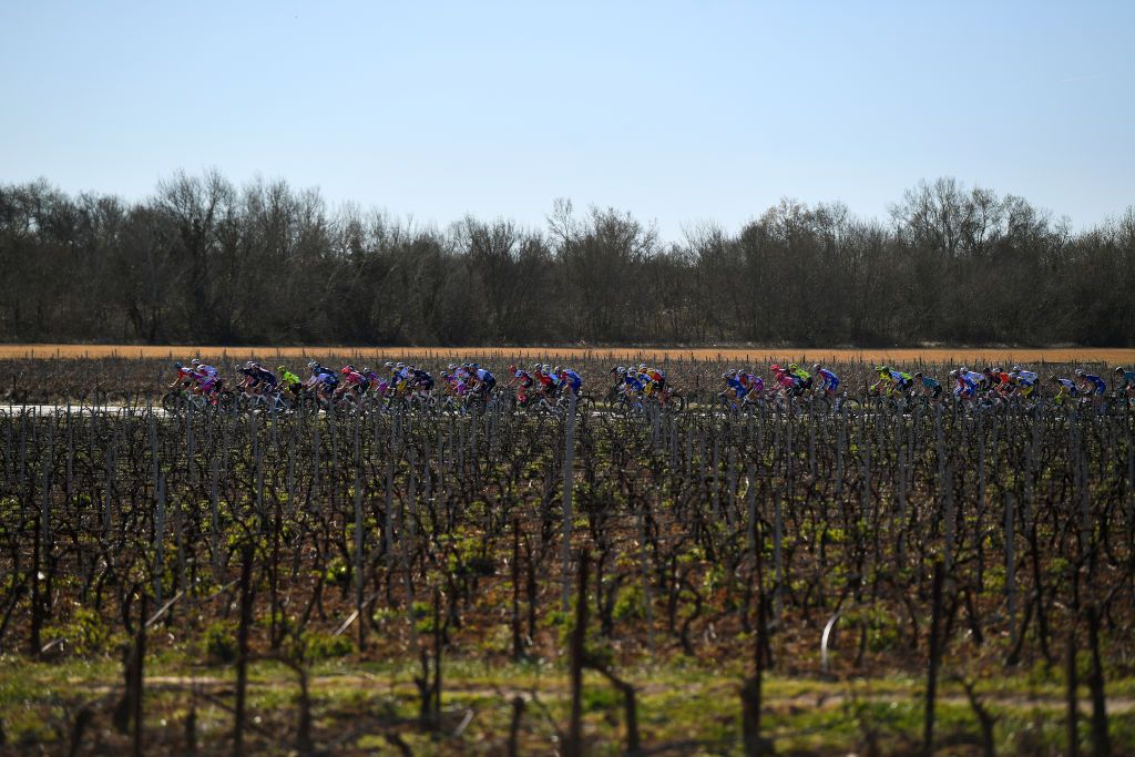 BELLEGARDESURVALSERINE FRANCE FEBRUARY 02 A general view of the Peloton passing through a Vineyards field during the 52nd toile De Bessges Tour Du Gard 2022 Stage 1 a 1608km stage from Bellegarde to Bellegarde 161m EtoiledeBesseges EDB2022 on February 02 2022 in BellegardesurValserine France Photo by Luc ClaessenGetty Images