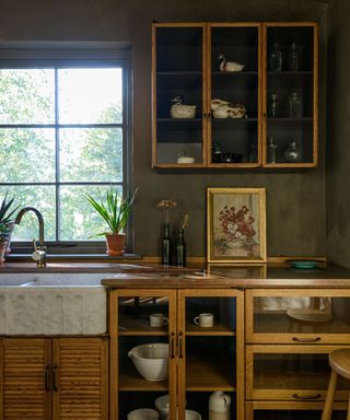 Atmospheric kitchen with vintage glass wall cabinets