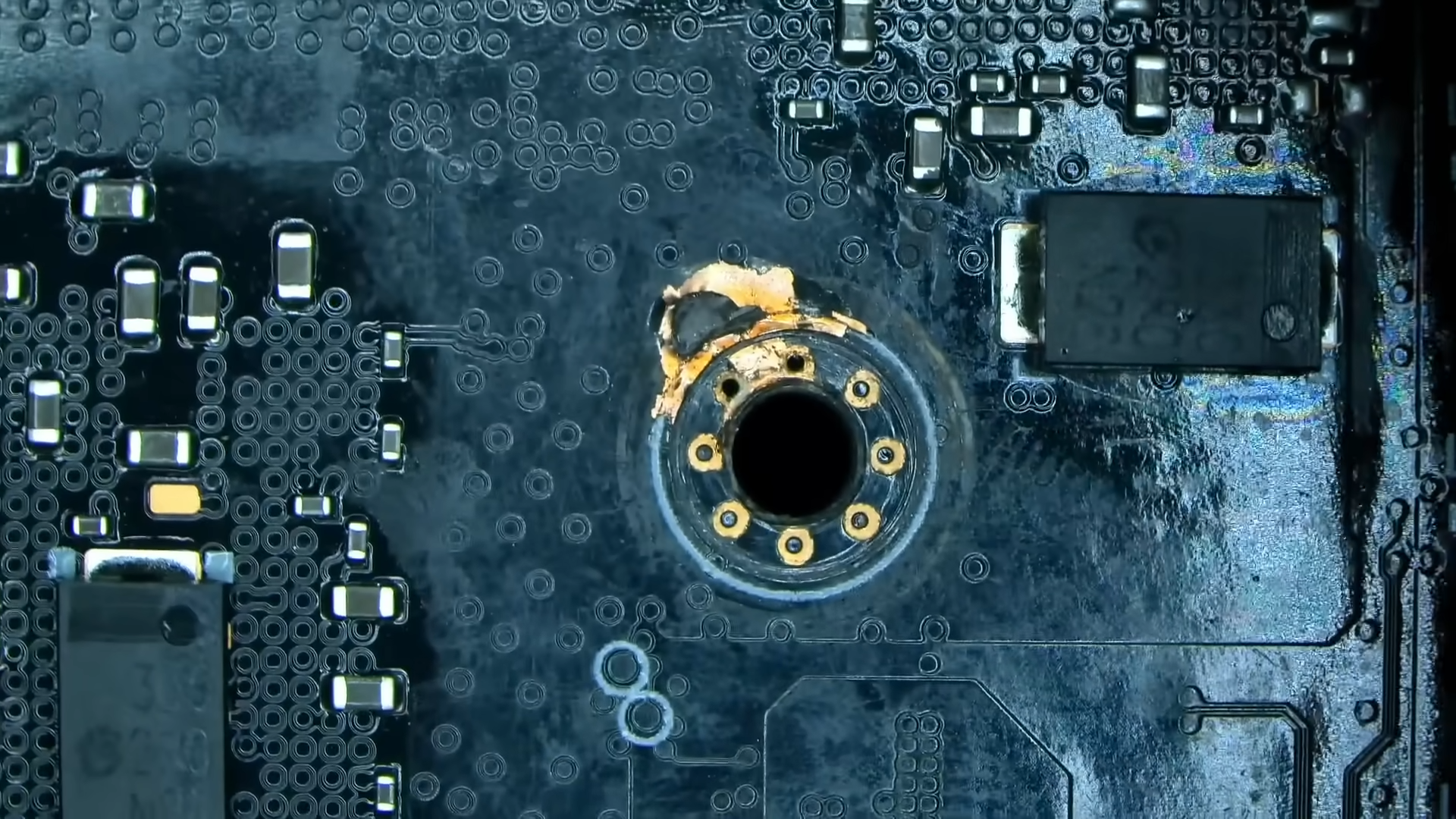 Grinded down mounting hole on an RTX 4090&#039;s PCB