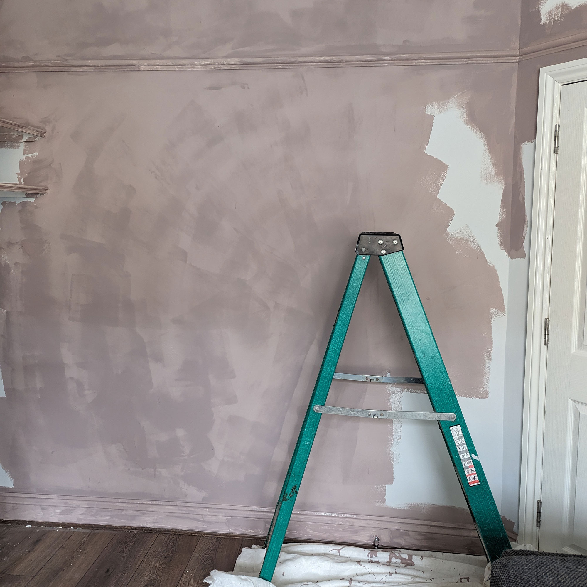 Wall being painted in dusky pink colour