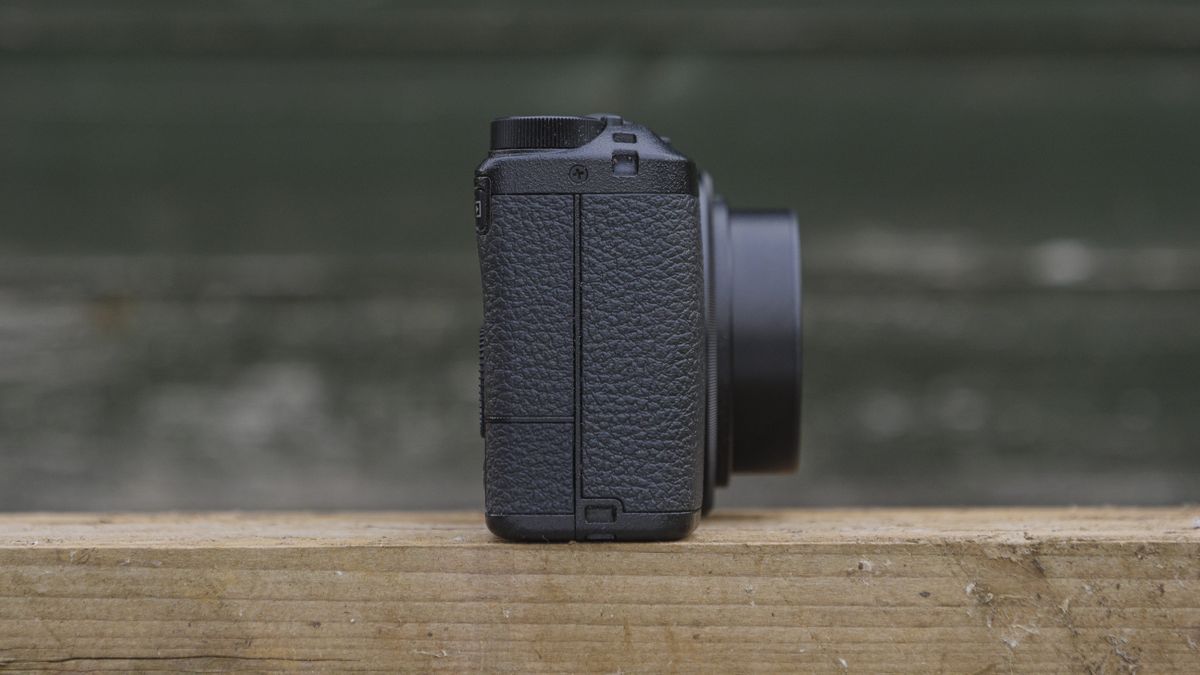 The Ricoh GR IIIx camera on a wooden table