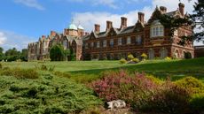 Sandringham estate viewed over garden shrubery