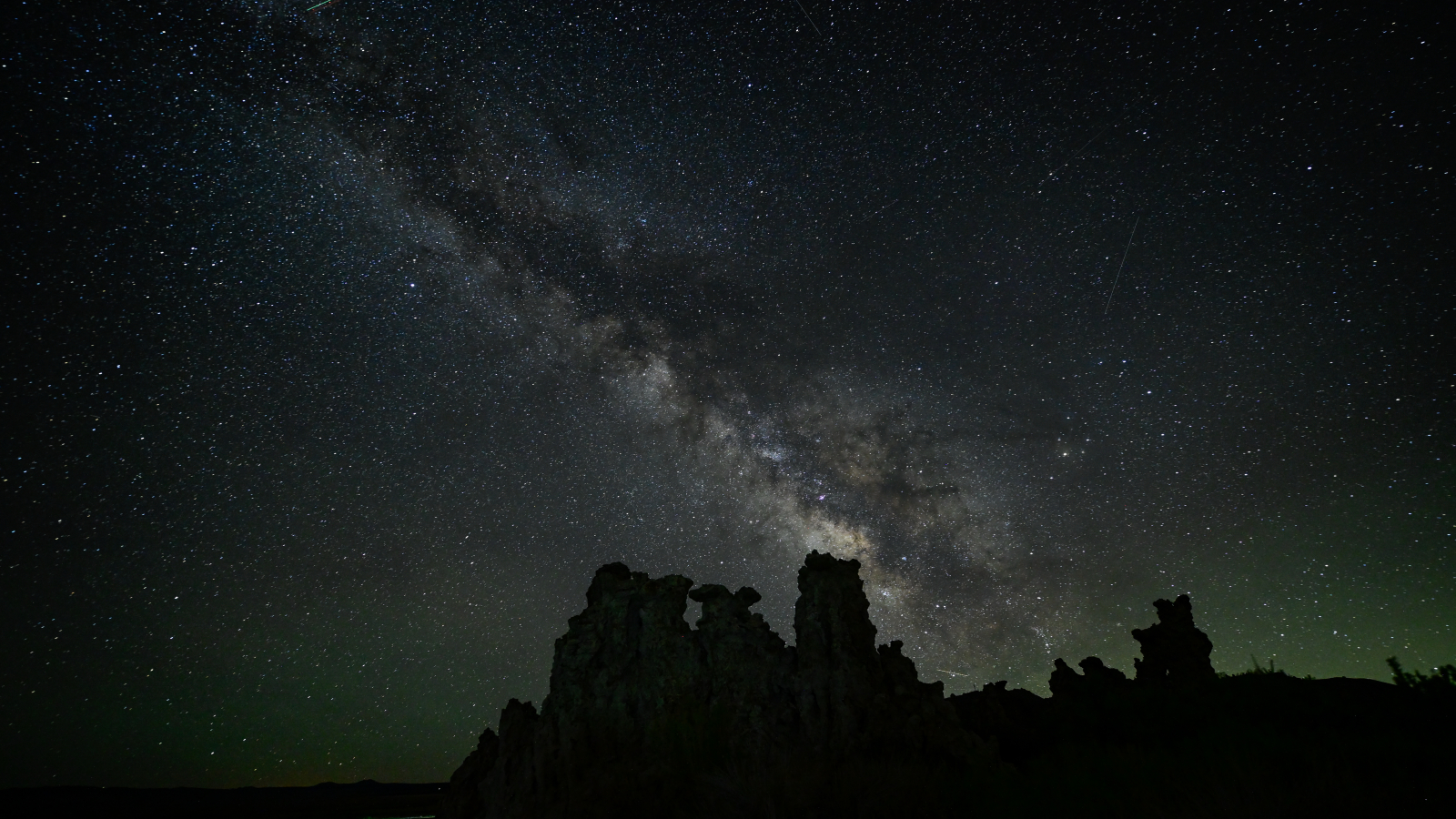Photo of the Night Sky showing the thick band of the Milky Way streaking across the heavens