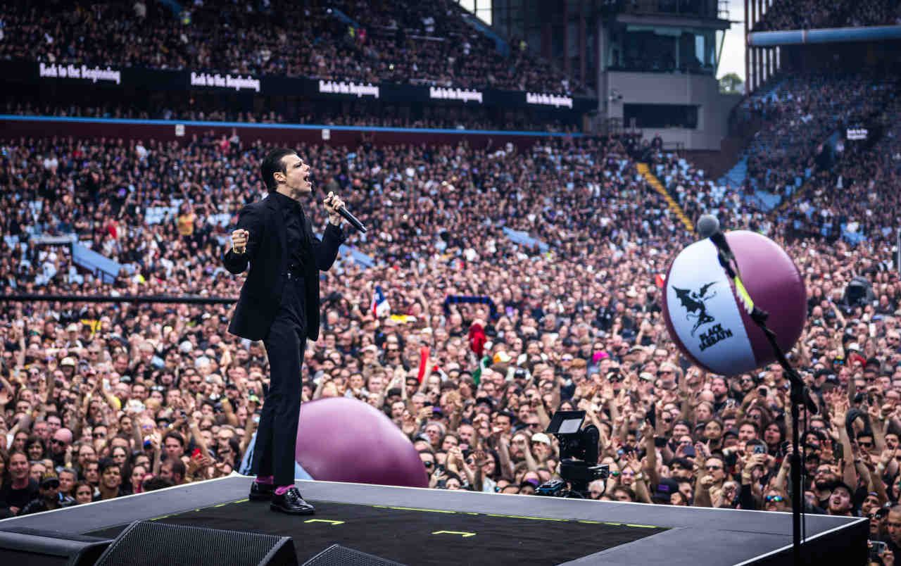 Yungblud performing onstage at the Back To The Beginning show at Villa Park in July 2025