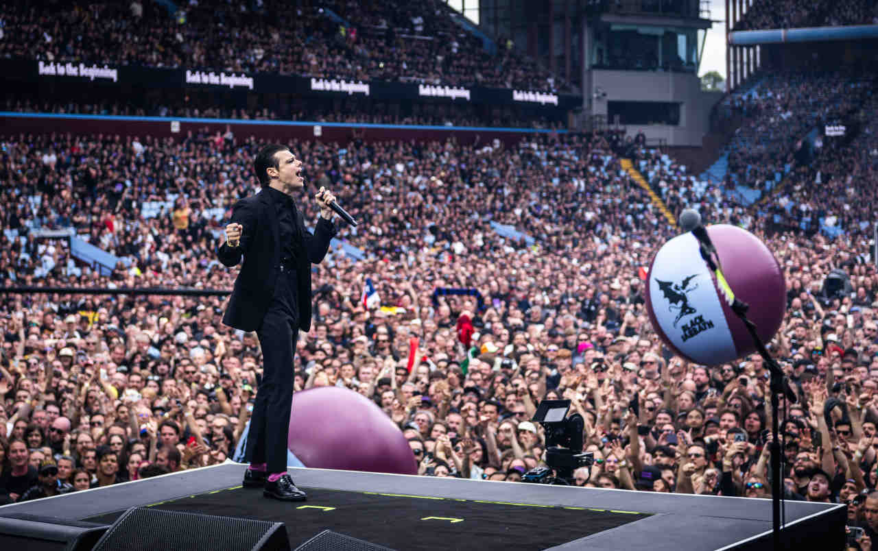 Yungblud performing onstage at the Back To The Beginning show at Villa Park in July 2025